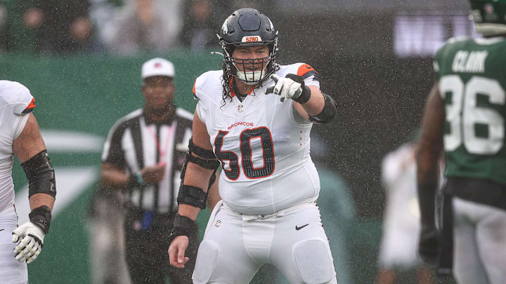 Denver Broncos center Luke Wattenberg (60) points during the first half against the New York Jets at MetLife Stadium. Denver Broncos center Luke Wattenberg (60) points during the first half against the New York Jets at MetLife Stadium.