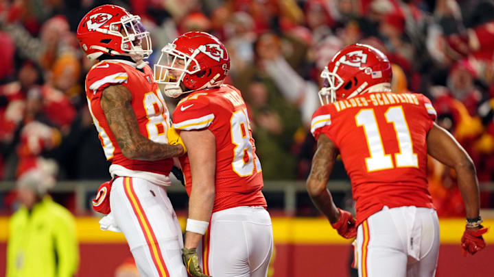 Kansas City Chiefs tight end Travis Kelce (center) celebrates with tight end Jody Fortson (left) after scoring a touchdown against the Cincinnati Bengals during the second quarter of the AFC Championship game at GEHA Field at Arrowhead Stadium.