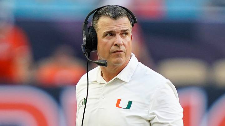 Nov 8, 2025; Miami Gardens, Florida, USA; Miami Hurricanes head coach Mario Cristobal looks at the scoreboard in a game against the Syracuse Orange during the second quarter at Hard Rock Stadium. Mandatory Credit: Jeff Romance-Imagn Images Nov 8, 2025; Miami Gardens, Florida, USA; Miami Hurricanes head coach Mario Cristobal looks at the scoreboard in a game against the Syracuse Orange during the second quarter at Hard Rock Stadium. Mandatory Credit: Jeff Romance-Imagn Images