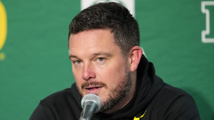 Nov 16, 2024; Madison, Wisconsin, USA;  Oregon Ducks head coach Dan Lanning talks to the media during the post game press conference following the game against the Wisconsin Badgers at Camp Randall Stadium. Mandatory Credit: Jeff Hanisch-Imagn Images