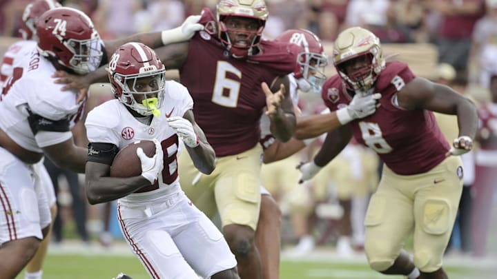 Aug 30, 2025; Tallahassee, Florida, USA; Alabama Crimson Tide running back Kevin Riley (28) runs with the ball against the Florida State Seminoles during the first half at Doak S. Campbell Stadium. Mandatory Credit: Melina Myers-Imagn Images