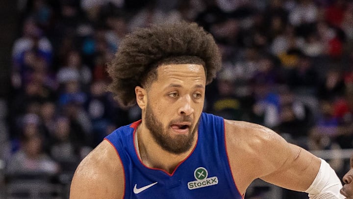 Sacramento Kings guard Dennis Schroder defends against Detroit Pistons guard Cade Cunningham. Sacramento Kings guard Dennis Schroder defends against Detroit Pistons guard Cade Cunningham.