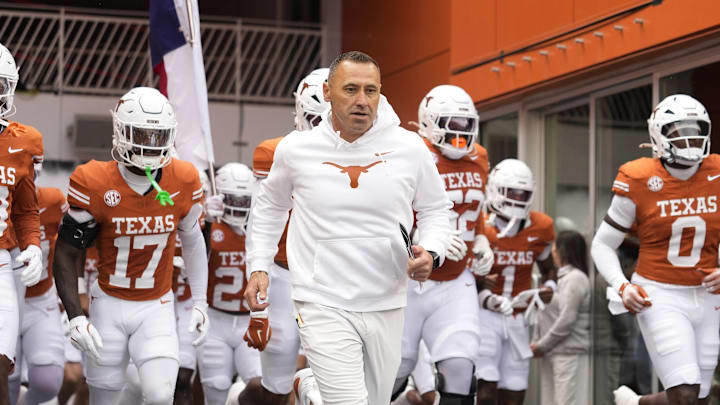 Texas Longhorns head coach Steve Sarkisian leads his team onto the field before a game against the Vanderbilt Commodores at Darrell K Royal-Texas Memorial Stadium. 