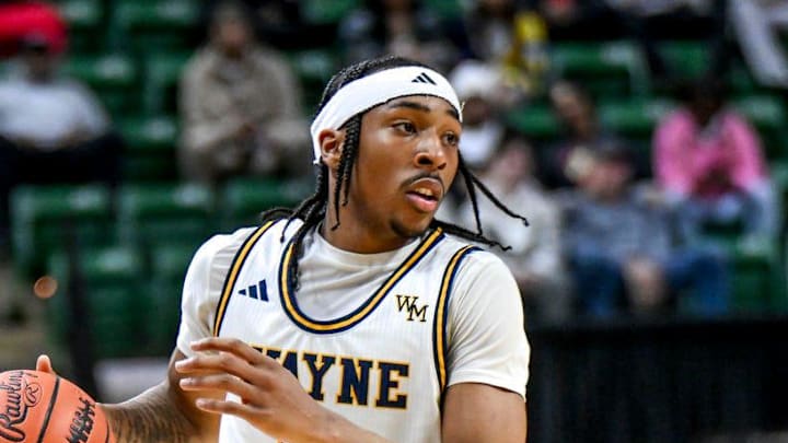 Wayne Memorial's Carlos Medlock Jr. moves the ball against Flint Carman-Ainsworth during the second quarter in the Division 1 state semifinal on Friday, March 14, 2025, at the Breslin Center in East Lansing. Wayne Memorial's Carlos Medlock Jr. moves the ball against Flint Carman-Ainsworth during the second quarter in the Division 1 state semifinal on Friday, March 14, 2025, at the Breslin Center in East Lansing.