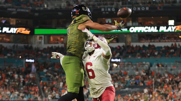 Oct 25, 2025; Miami Gardens, Florida, USA; Miami Hurricanes wide receiver CJ Daniels (7) catches the football for a touchdown against Stanford Cardinal cornerback Jay Green (5) during the second quarter at Hard Rock Stadium. Mandatory Credit: Sam Navarro-Imagn Images Oct 25, 2025; Miami Gardens, Florida, USA; Miami Hurricanes wide receiver CJ Daniels (7) catches the football for a touchdown against Stanford Cardinal cornerback Jay Green (5) during the second quarter at Hard Rock Stadium. Mandatory Credit: Sam Navarro-Imagn Images
