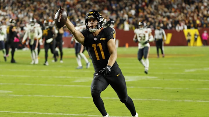 Oct 13, 2025; Landover, Maryland, USA; Washington Commanders wide receiver Luke McCaffrey (11) scores a touchdown against the Chicago Bears during the third quarter at Northwest Stadium. Mandatory Credit: Geoff Burke-Imagn Images Oct 13, 2025; Landover, Maryland, USA; Washington Commanders wide receiver Luke McCaffrey (11) scores a touchdown against the Chicago Bears during the third quarter at Northwest Stadium. Mandatory Credit: Geoff Burke-Imagn Images
