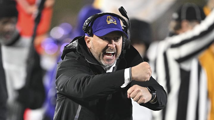 Dec 28, 2024; Annapolis, MD, USA; East Carolina Pirates head coach Blake Harrell reacts during the first half of the Go Bowling Military Bowl against the North Carolina State Wolfpack at Navy-Marine Corps Memorial Stadium. Mandatory Credit: Tommy Gilligan-Imagn Images Dec 28, 2024; Annapolis, MD, USA; East Carolina Pirates head coach Blake Harrell reacts during the first half of the Go Bowling Military Bowl against the North Carolina State Wolfpack at Navy-Marine Corps Memorial Stadium. Mandatory Credit: Tommy Gilligan-Imagn Images
