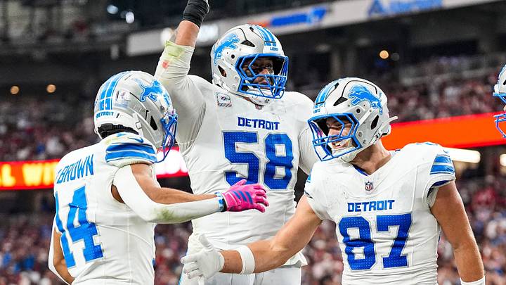 Detroit Lions tight end Sam LaPorta (87) celebrates a touchdown against Arizona Cardinals with wide receiver Amon-Ra St. Brown (14), offensive tackle Penei Sewell (58) and tight end Brock Wright (89) during the first half at State Farm Stadium in Glendale, Arizona on Sunday, Oct. 11, 2026.