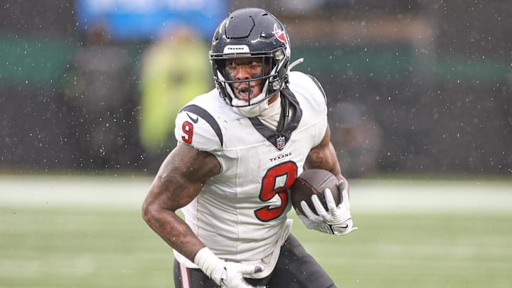 Dec 10, 2023; East Rutherford, New Jersey, USA; Houston Texans tight end Brevin Jordan (9) gains yards after catch during the second half against the New York Jets at MetLife Stadium. Mandatory Credit: Vincent Carchietta-Imagn Images
