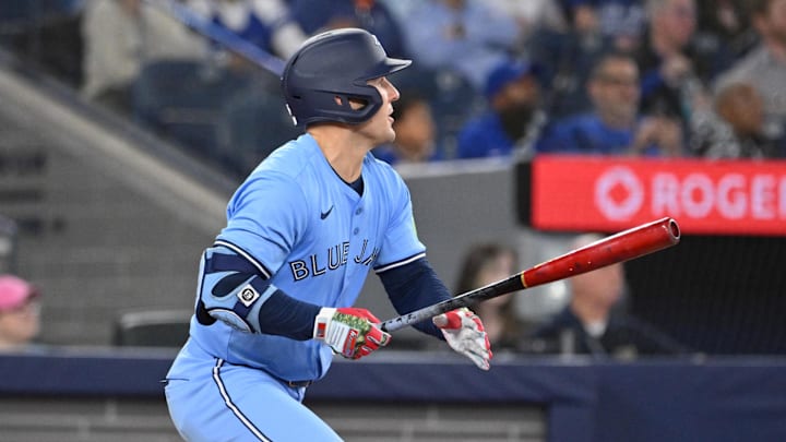 May 1, 2025; Toronto, Ontario, CAN; Toronto Blue Jays center fielder Daulton Varsho (5) hits a solo home run against the Boston Red Sox in the seventh inning at Rogers Centre. May 1, 2025; Toronto, Ontario, CAN; Toronto Blue Jays center fielder Daulton Varsho (5) hits a solo home run against the Boston Red Sox in the seventh inning at Rogers Centre.
