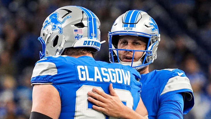 Detroit Lions guard Graham Glasgow (60) talks to quarterback Jared Goff (16) at warmup ahead of the Minnesota Vikings game at Ford Field in Detroit on Sunday, November 2, 2025. Detroit Lions guard Graham Glasgow (60) talks to quarterback Jared Goff (16) at warmup ahead of the Minnesota Vikings game at Ford Field in Detroit on Sunday, November 2, 2025.