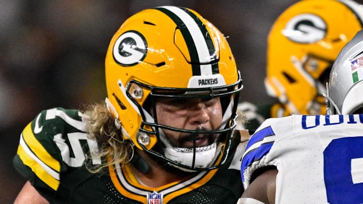 Green Bay Packers lineman Sean Rhyan gets ready to block Dallas Cowboys defensive tackle Osa Odighizuwa.