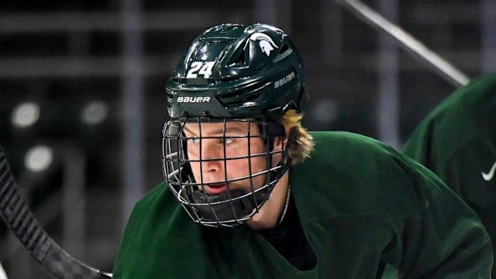 Michigan State's Nathan Mackie moves the puck during hockey practice on Thursday, Sept. 25, 2025, at Munn Arena in East Lansing.