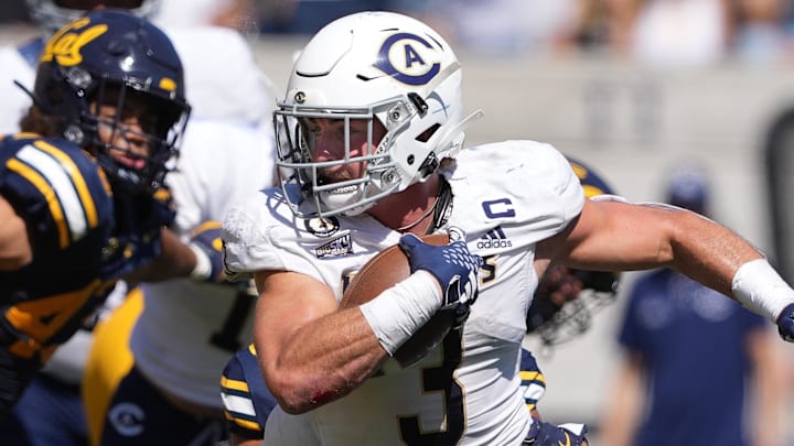 Aug 31, 2024; Berkeley, California, USA; UC Davis Aggies running back Lan Larison (3) carries the ball against the California Golden Bears during the second quarter at California Memorial Stadium. Mandatory Credit: Darren Yamashita-Imagn Images