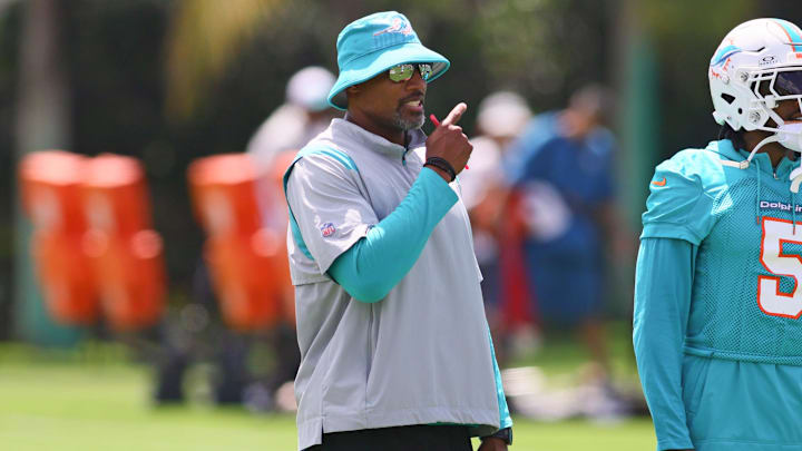 Jun 4, 2024; Miami Gardens, FL, USA; Miami Dolphins defensive coordinator Anthony Weaver talks to cornerback Jalen Ramsey (5) during mandatory minicamp at Baptist Health Training Complex. Mandatory Credit: Sam Navarro-Imagn Images