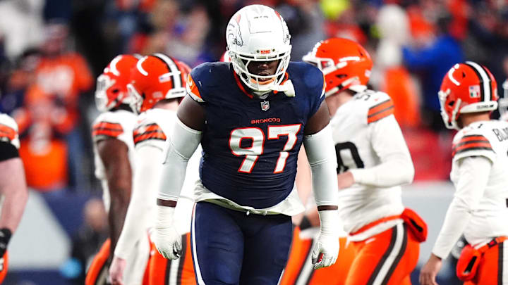 Dec 2, 2024; Denver, Colorado, USA; Denver Broncos defensive tackle Malcolm Roach (97) celebrates a missed field goal by the Cleveland Browns in the first quarter at Empower Field at Mile High. 