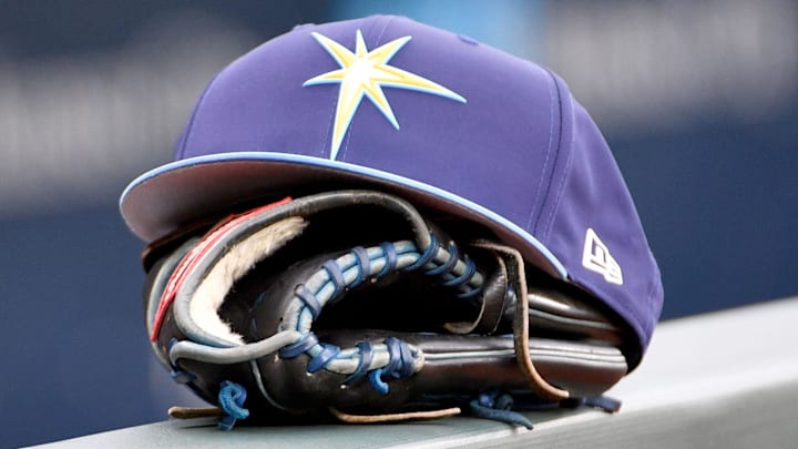 May 14, 2018; Kansas City, MO, USA; A general view of a Tampa Bay Rays hat and glove on the dugout fence before the game against the Kansas City Royals at Kauffman Stadium.