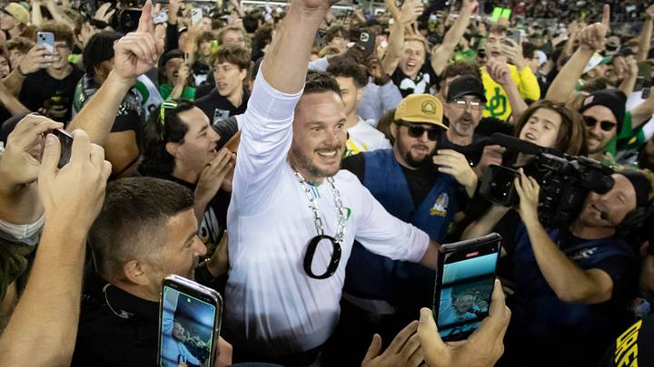 Oregon Ducks head coach Dan Lanning celebrates amid a crowd of fans on the field as the No. 3 Oregon Ducks knock off the No. 2 Ohio State Buckeyes 32-31 Saturday, Oct. 12, 2024 at Autzen Stadium in Eugene, Ore. Oregon Ducks head coach Dan Lanning celebrates amid a crowd of fans on the field as the No. 3 Oregon Ducks knock off the No. 2 Ohio State Buckeyes 32-31 Saturday, Oct. 12, 2024 at Autzen Stadium in Eugene, Ore.