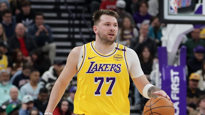 Feb 12, 2025; Salt Lake City, Utah, USA;  Los Angeles Lakers guard Luka Doncic (77) dribbles during the first quarter against the Utah Jazz at Delta Center. Mandatory Credit: Chris Nicoll-Imagn Images