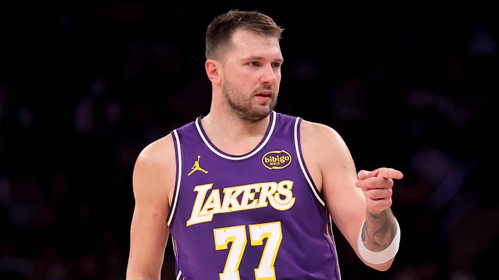 Feb 1, 2026; New York, New York, USA; Los Angeles Lakers guard Luka Doncic (77) points in the direction of Knicks fan Spike Lee (not pictured) after a three point shot against the New York Knicks during the third quarter at Madison Square Garden. Mandatory Credit: Brad Penner-Imagn Images