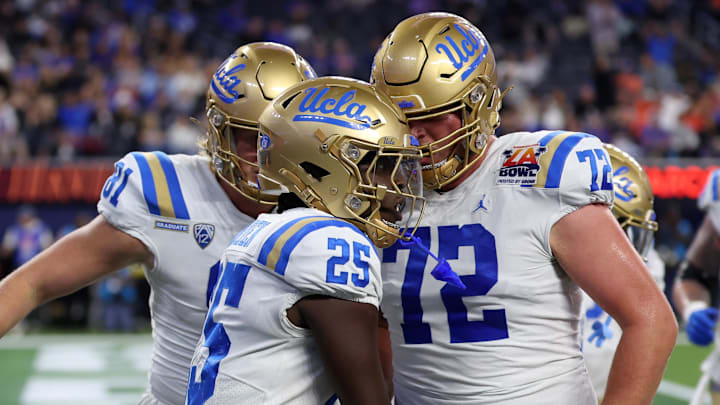 Dec 16, 2023; Inglewood, CA, USA; UCLA Bruins running back TJ Harden (25) celebrates with offensive lineman Garrett DiGiorgio (72) after scoring a touchdown during the third quarter of the LA Bowl at SoFi Stadium. Mandatory Credit: Kiyoshi Mio-Imagn Images Dec 16, 2023; Inglewood, CA, USA; UCLA Bruins running back TJ Harden (25) celebrates with offensive lineman Garrett DiGiorgio (72) after scoring a touchdown during the third quarter of the LA Bowl at SoFi Stadium. Mandatory Credit: Kiyoshi Mio-Imagn Images