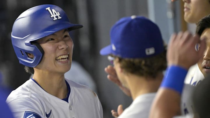 Los Angeles Dodgers second baseman Hyeseong Kim (6) celebates in the dugout after scoring in the third inning against the Athletics at Dodger Stadium on May 15.