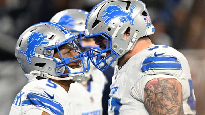 Detroit Lions running back David Montgomery (5) celebrates with center Trystan Colon (57) after a touchdown 