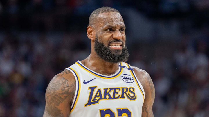 Los Angeles Lakers forward LeBron James speaks with a referee during a game.