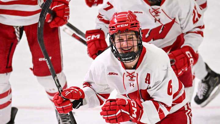 Wisconsin Badgers right wing Lacey Eden (6) leads teammates to the bench after she scored against the Minnesota Gophers in the second period of a game Sunday, February 9, 2025, at LaBahn Arena in Madison, Wisconsin.