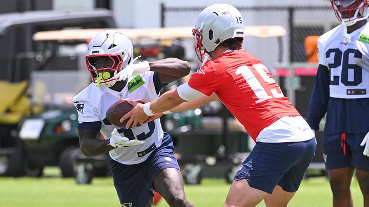 Jun 2, 2026; Foxborough, MA, USA; New England Patriots quarterback Behren Morton (15) hands the ball off to running back Myles Montgomery (39) during the team's OTA at Gillette Stadium. Mandatory Credit: Eric Canha-Imagn Images Jun 2, 2026; Foxborough, MA, USA; New England Patriots quarterback Behren Morton (15) hands the ball off to running back Myles Montgomery (39) during the team's OTA at Gillette Stadium. Mandatory Credit: Eric Canha-Imagn Images
