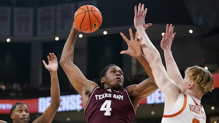Texas A&M Aggies forward Jamie Vinson (4) makes a jump shot against Texas Longhorns center Matas Vokietaitis (8) during the first half at Moody Center. Texas A&M Aggies forward Jamie Vinson (4) makes a jump shot against Texas Longhorns center Matas Vokietaitis (8) during the first half at Moody Center.
