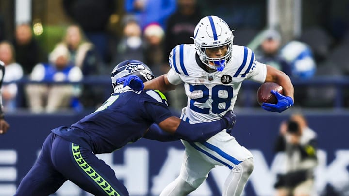 Dec 14, 2025; Seattle, Washington, USA; Indianapolis Colts running back Jonathan Taylor (28) rushes against the Seattle Seahawks during the second half at Lumen Field. 