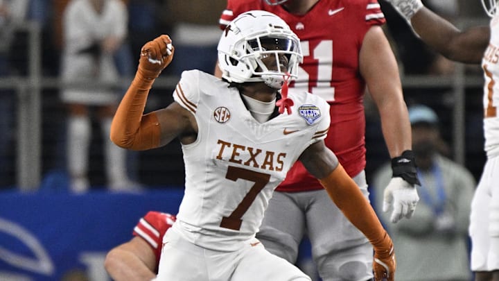 Jan 10, 2025; Arlington, Texas, USA; Texas Longhorns defensive back Jahdae Barron (7) celebrates after a sack during the second quarter of the College Football Playoff semifinal against the Ohio State Buckeyes in the Cotton Bowl at AT&T Stadium. Mandatory Credit: Jerome Miron-Imagn Images