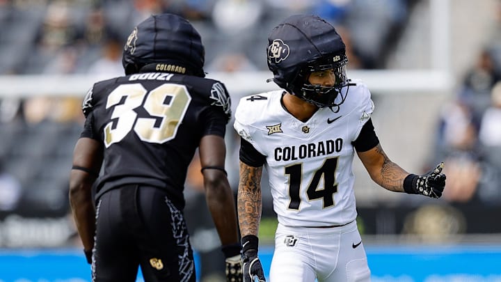 Apr 19, 2025; Boulder, CO, USA; Colorado Buffaloes wide receiver Quanell Farrakhan Jr. (14) and cornerback Ben Bouzi (39) during the spring game at Folsom Field. Mandatory Credit: Isaiah J. Downing-Imagn Images