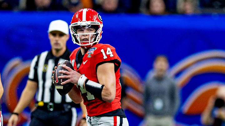 Jan 2, 2025; New Orleans, LA, USA; Georgia Bulldogs quarterback Gunner Stockton (14) makes a pass during the second quarter against the Notre Dame Fighting Irish at Caesars Superdome. Mandatory Credit: Stephen Lew-Imagn Images