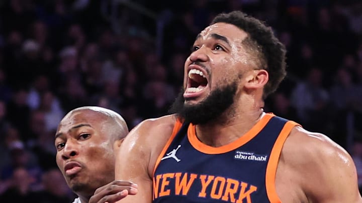 New York Knicks center Karl-Anthony Towns drives past Dallas Mavericks forward Kai Jones.