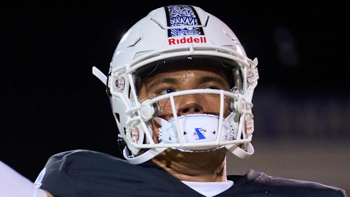 Nov. 25, 2022; Chandler, AZ, USA; Chandler Wolves quarterback Dylan Raiola (1) warms up to face the