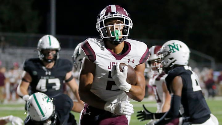 Jenks' Kaydin Jones scores a touchdown during the high school football game between Norman North and Jenks at Harve Collins Field in Norman, Okla., Thursday, Oct. 5, 2023.