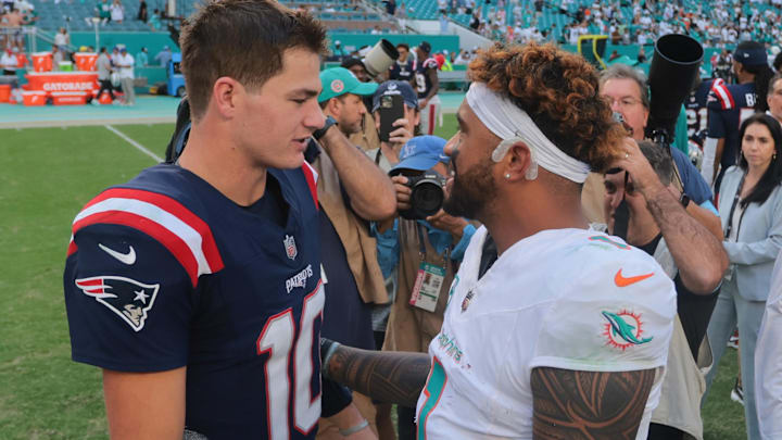 Nov 24, 2024; Miami Gardens, Florida, USA; New England Patriots quarterback Drake Maye (10) and Miami Dolphins quarterback Tua Tagovailoa (1) talk on the field after the game at Hard Rock Stadium. Mandatory Credit: Sam Navarro-Imagn Images Nov 24, 2024; Miami Gardens, Florida, USA; New England Patriots quarterback Drake Maye (10) and Miami Dolphins quarterback Tua Tagovailoa (1) talk on the field after the game at Hard Rock Stadium. Mandatory Credit: Sam Navarro-Imagn Images
