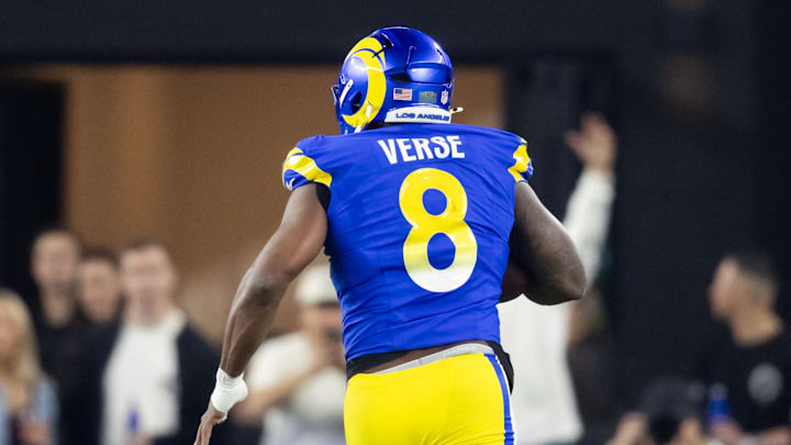 Jan 13, 2025; Glendale, AZ, USA; Los Angeles Rams linebacker Jared Verse (8) returns a fumble for a touchdown against the Minnesota Vikings during an NFC wild card game at State Farm Stadium. Mandatory Credit: Mark J. Rebilas-Imagn Images