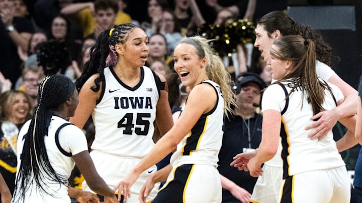 The Iowa Hawkeyes react during a basketball game against the Michigan Wolverines Feb. 22, 2026 at Carver-Hawkeye Arena in Iowa City, Iowa. The Iowa Hawkeyes react during a basketball game against the Michigan Wolverines Feb. 22, 2026 at Carver-Hawkeye Arena in Iowa City, Iowa.