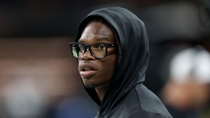 Aug 17, 2025; New Orleans, Louisiana, USA; Jacksonville Jaguars wide receiver Travis Hunter (12) watches from the sidelines during a game against the New Orleans Saints at Caesars Superdome. 