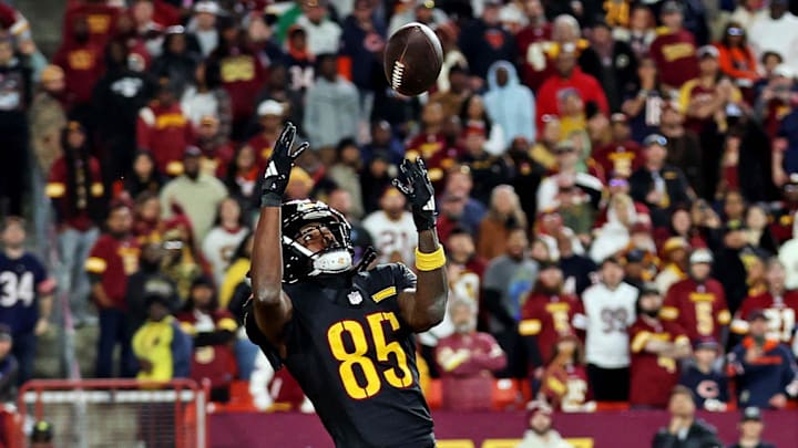 Oct 27, 2024; Landover, Maryland, USA; Washington Commanders wide receiver Noah Brown (85) catches a Hail Mary pass with no time left to beat the Chicago Bears at Commanders Field. Mandatory Credit: Peter Casey-Imagn Images