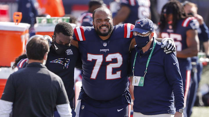 Oct 18, 2020; Foxborough, Massachusetts, USA; New England Patriots guard Jermaine Eluemunor (72) is helped off the field after suffering an apparent injury during the first quarter against the Denver Broncos at Gillette Stadium. Mandatory Credit: Winslow Townson-Imagn Images