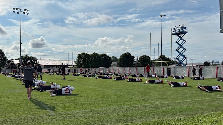 Louisville players warming up during fall camp Louisville players warming up during fall camp