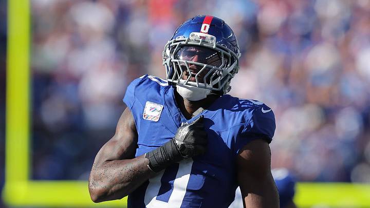 Sep 28, 2025; East Rutherford, New Jersey, USA; New York Giants linebacker Brian Burns (0) celebrates after sacking Los Angeles Chargers quarterback Justin Herbert (10) (not pictured) during the fourth quarter at MetLife Stadium. Mandatory Credit: Brad Penner-Imagn Images