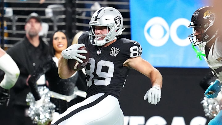Dec 22, 2024; Paradise, Nevada, USA; Las Vegas Raiders tight end Brock Bowers (89) gains yardage against the Jacksonville Jaguars during the fourth quarter at Allegiant Stadium. Mandatory Credit: Stephen R. Sylvanie-Imagn Images