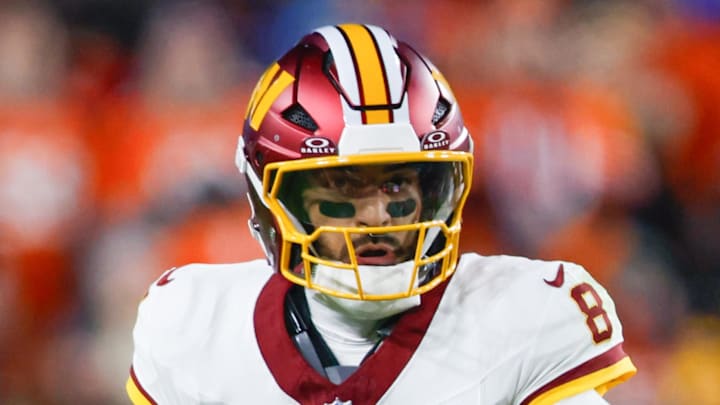 Washington Commanders quarterback Marcus Mariota scrambles with the ball against the Denver Broncos. Washington Commanders quarterback Marcus Mariota scrambles with the ball against the Denver Broncos.