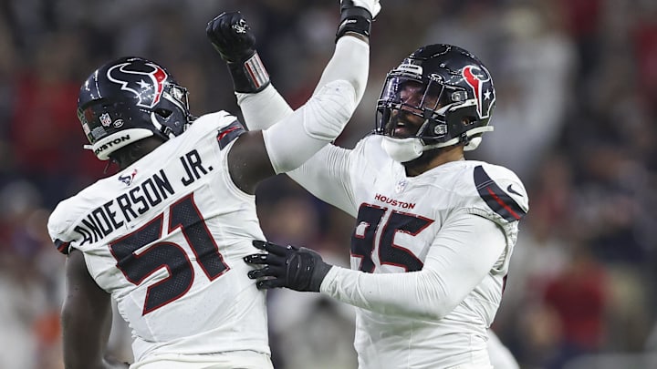 Sep 15, 2024; Houston, Texas, USA; Houston Texans defensive end Derek Barnett (95) celebrates with defensive end Will Anderson Jr. (51) after a sack during the second quarter against the Chicago Bears at NRG Stadium. Mandatory Credit: Troy Taormina-Imagn Images