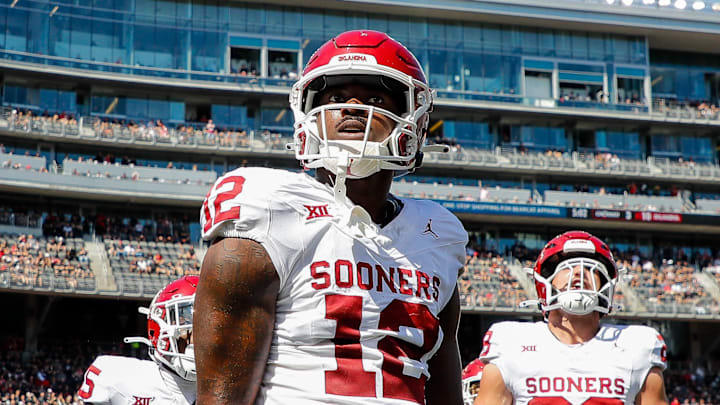 Sep 23, 2023; Cincinnati, Ohio, USA; Oklahoma Sooners defensive back Key Lawrence (12) reacts after intercepting the ball during the first half against the Cincinnati Bearcats at Nippert Stadium. Mandatory Credit: Katie Stratman-Imagn Images